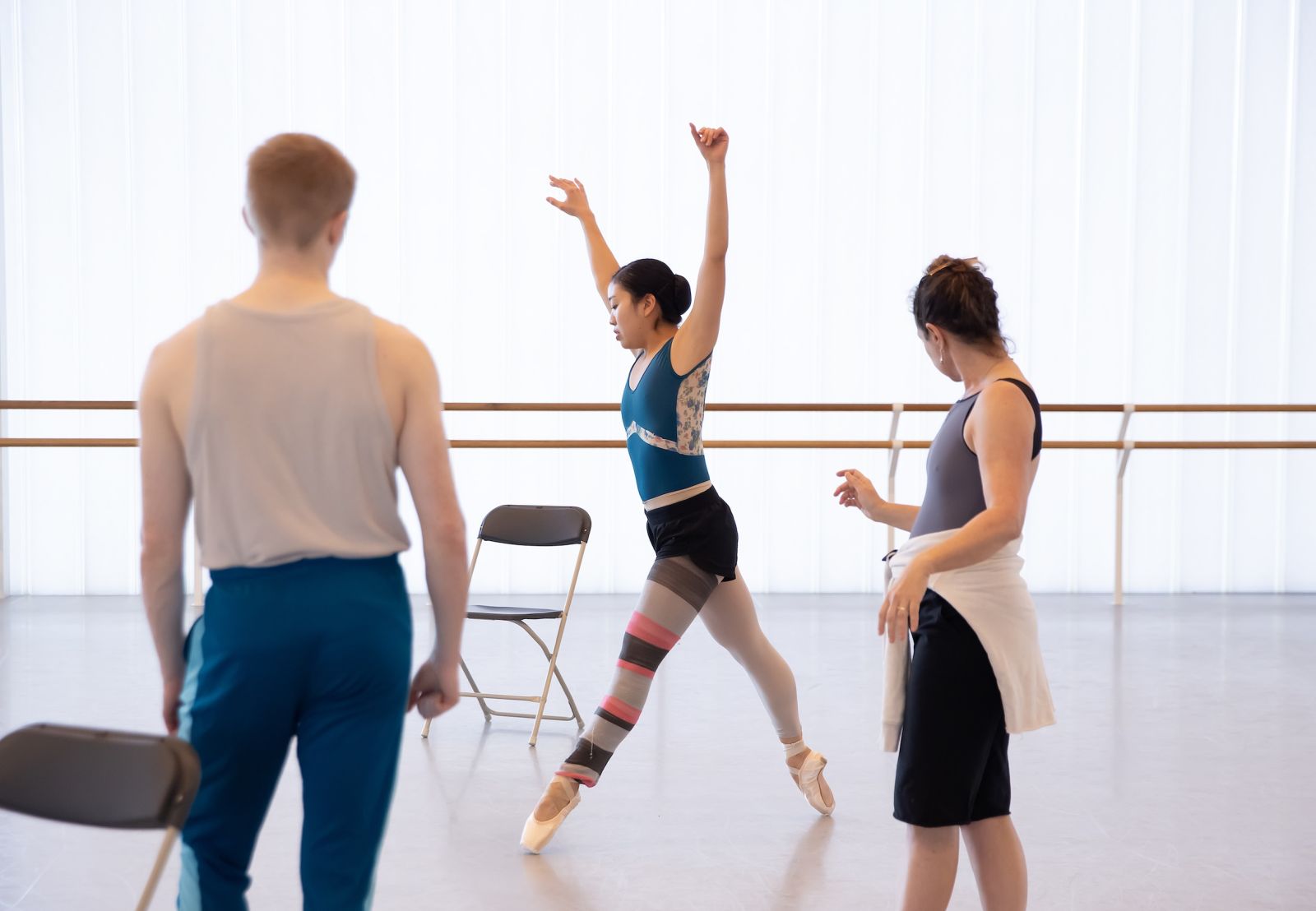 Odysseus and Calypso (Tamara Hinson) dance as Athena looks on.