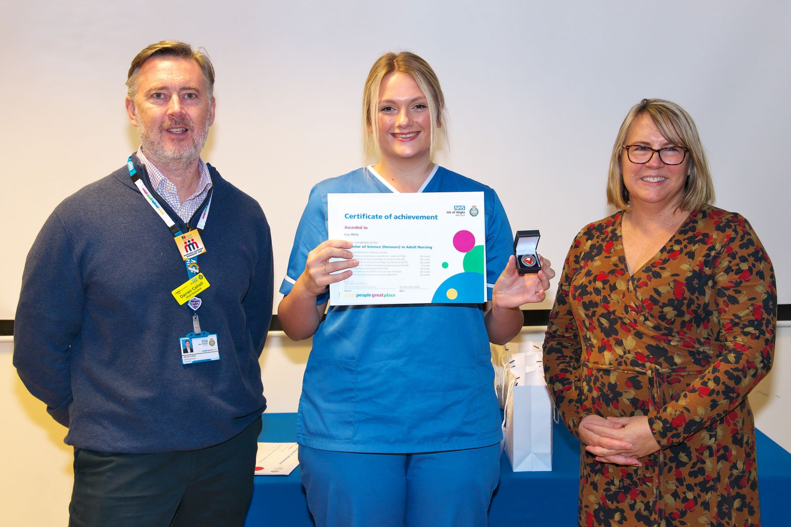 •	Darren Cattell, CEO Isle of Wight NHS Trust (LHS), Isobel Wells, Registered Nurse (Centre), Juliet Pearce, Director of Nursing, Midwifery and AHPs Isle of Wight NHS Trust (RHS)