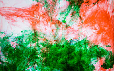 Ink swirls of red and green ink representing our theme 'environment and politics'