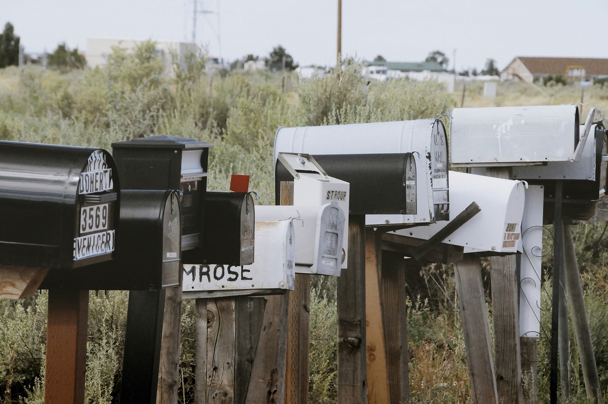 old mailboxes lined up next to each other