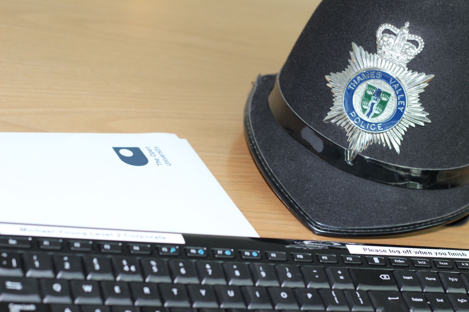 Police hat and OU document