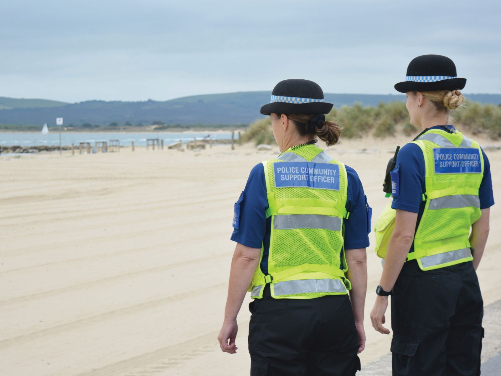 Police women looking out to sea
