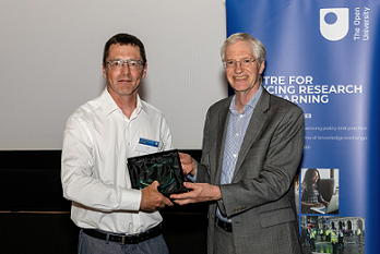 Dr Paul Walley receives the award presented by Professor Tim Blackman, Vice-Chancellor, OU