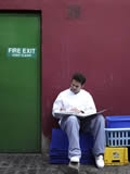 Chef reading outside fire exit