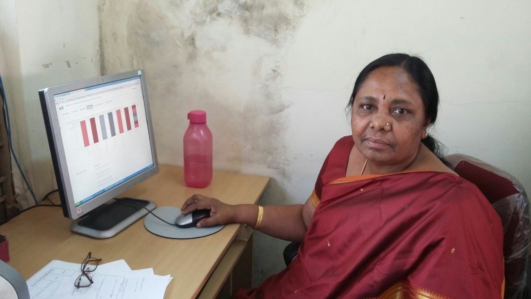 Senior Lecturer of DIET Bangalore Rural, Karnataka, using a computer to undertake the MOOC