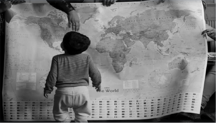 Image of child looking at world map