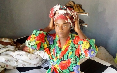 Photo shows a trans woman at home on her bed. She told us "I'm already awake, with focus and determination for a new day"