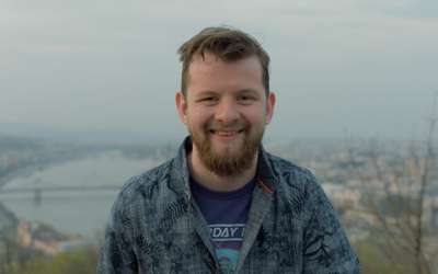 A photo of Colm smiling outdoors in Budapest