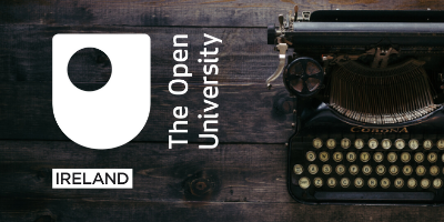 The Open University in Ireland logo next to a typewriter on a wooden table