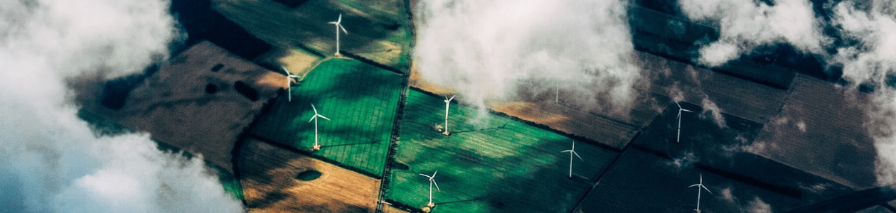 a birdseye view of wind turbines in the conutryside