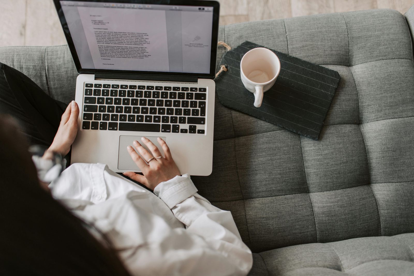 A person using a computer on a couch. Photo by Vlada Karpovich: https://www.pexels.com/photo/crop-woman-using-laptop-on-sofa-at-home-4050304/