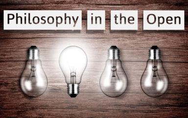 A row of 4 lightbulb, one of which is lit up and turned upside down. Above are the words, 'Philosophy in the Open'.