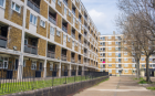 An image of a block of cream coloured flats