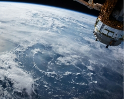 A satellite in space circulating above the earth