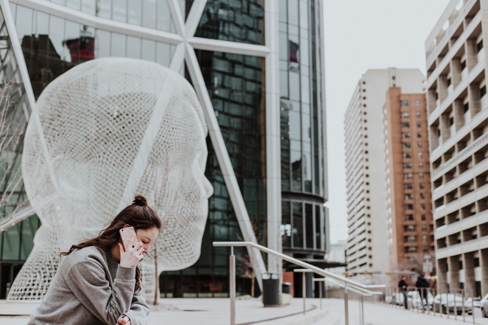 Image of person on the phone in a city