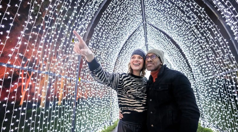 Two people in a light arch way