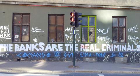 Grafitti that says 'The Banks are the real criminals'.