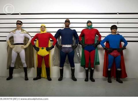 A lineup of men wearing superhero outfits.