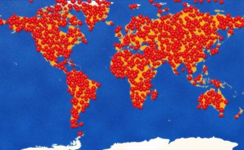 The world with red markers covering land.