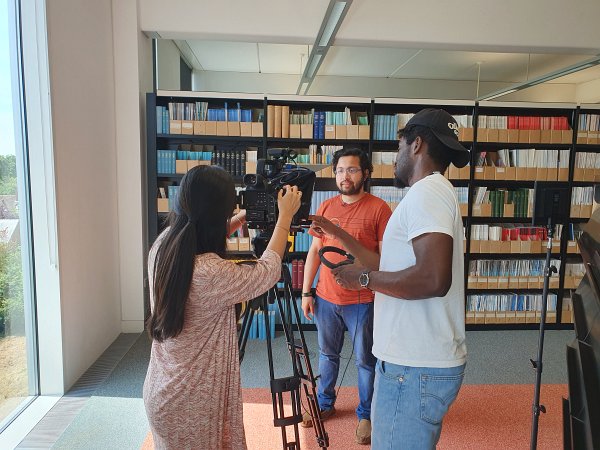 GRACE team filming in the library 1