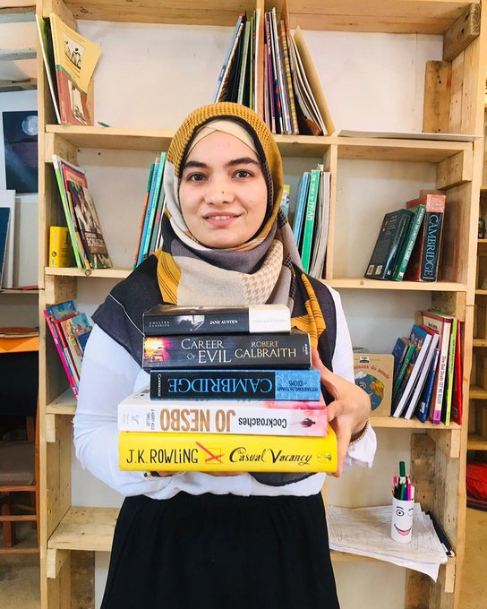 Parwana Amiri holds a book in her hand