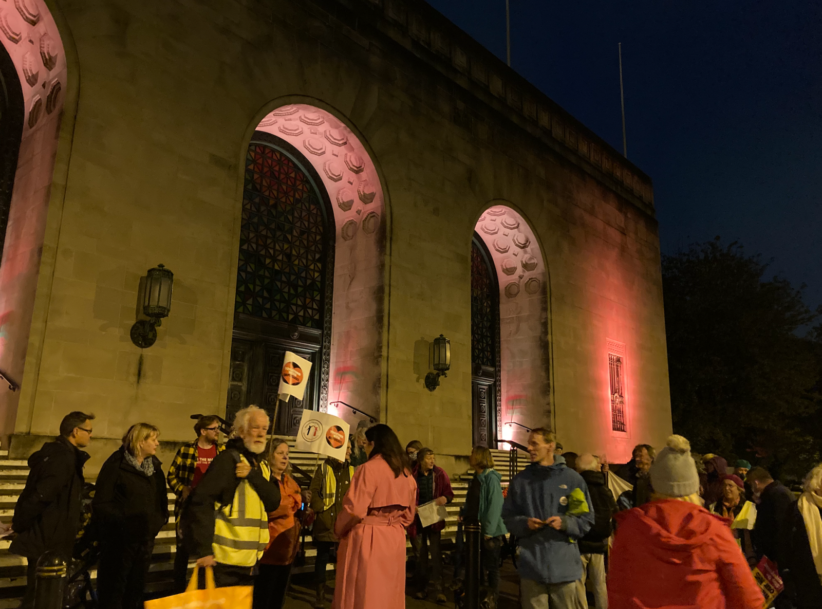 members of the community march at Guildhall with refugees