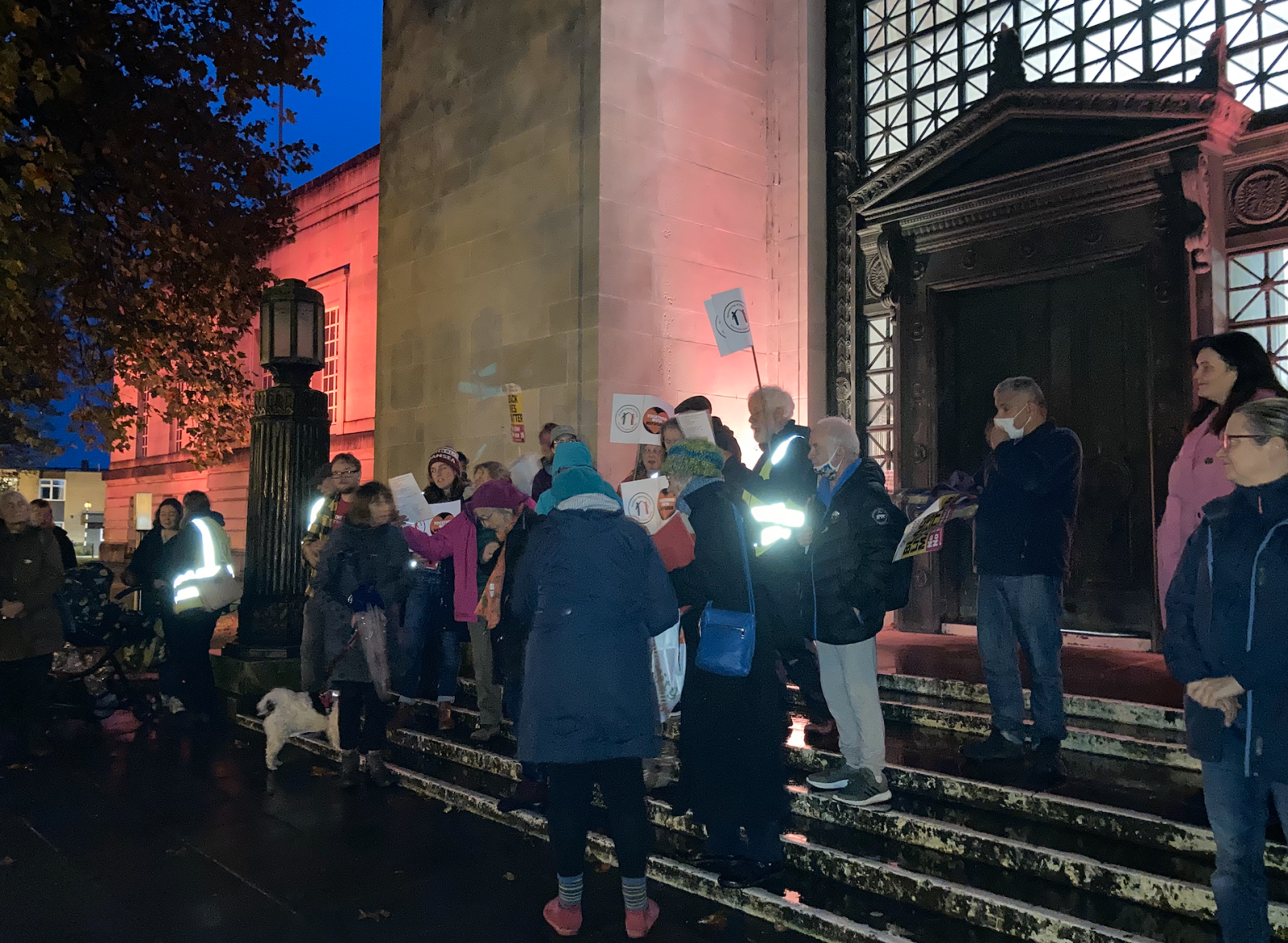 members of the community march at Guildhall with refugees