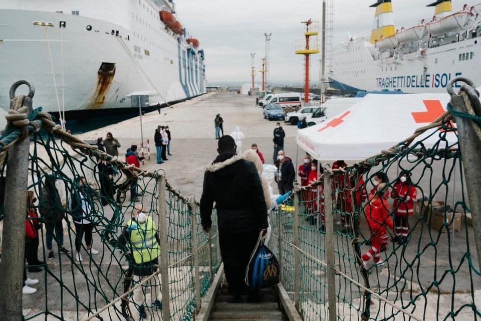 Refugee walks off boat