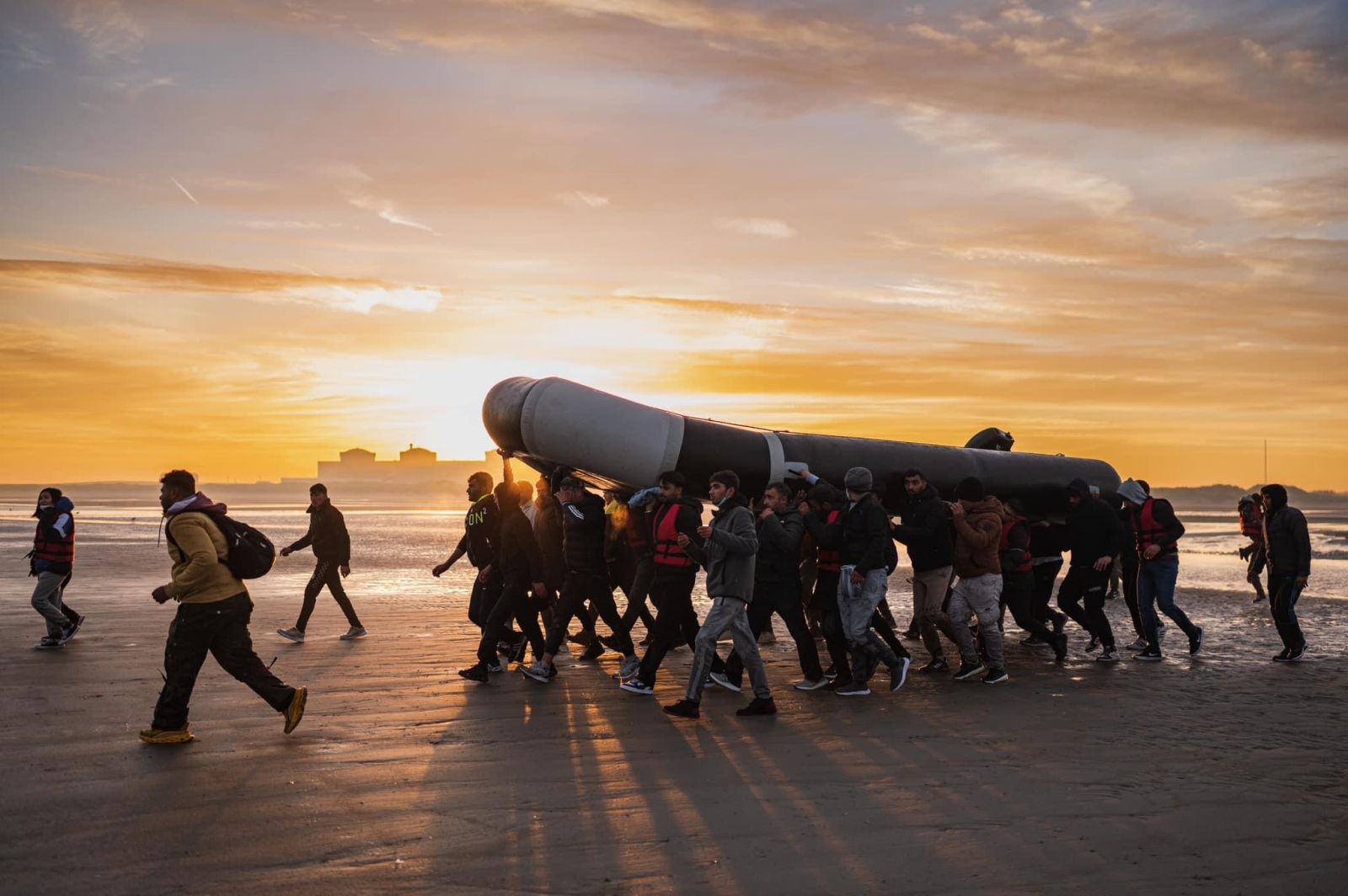 people carrying a live boat