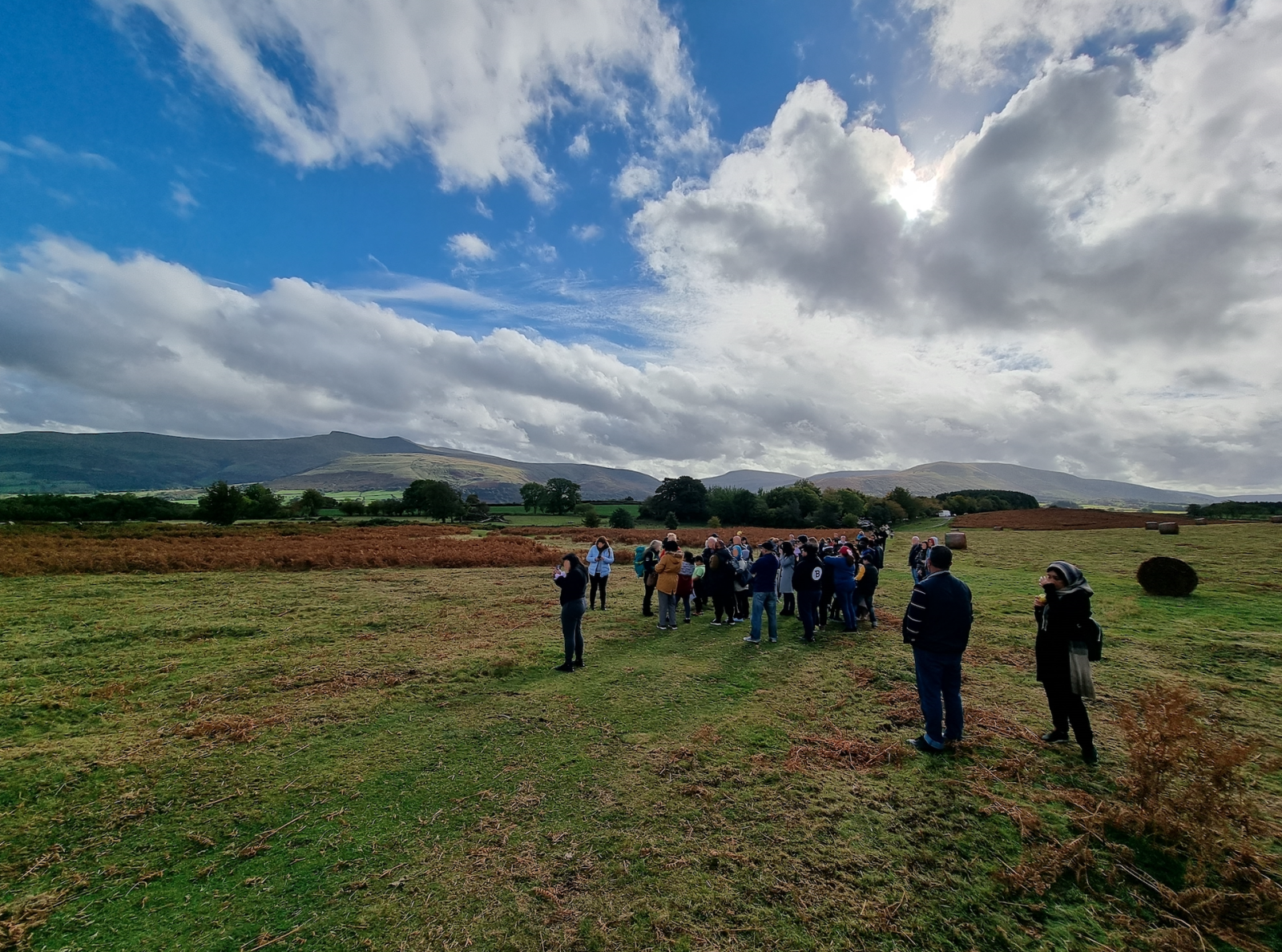 A group of people standing in Brecon Beacons