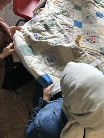 A young boy reading in the shelter