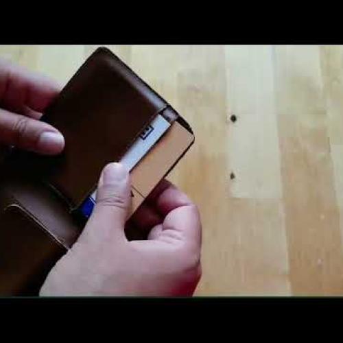 a hand on a purse