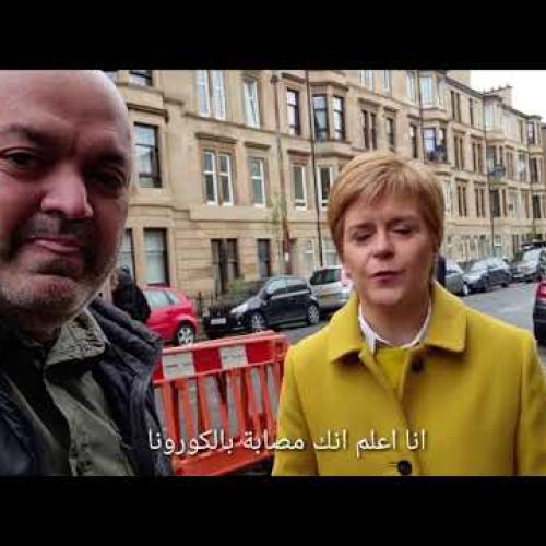 Nicola Sturgeon and Adnan Shamdin on a street