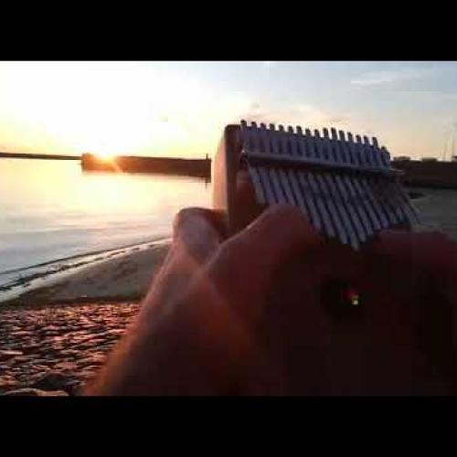 Playing Kalimba on the Beach