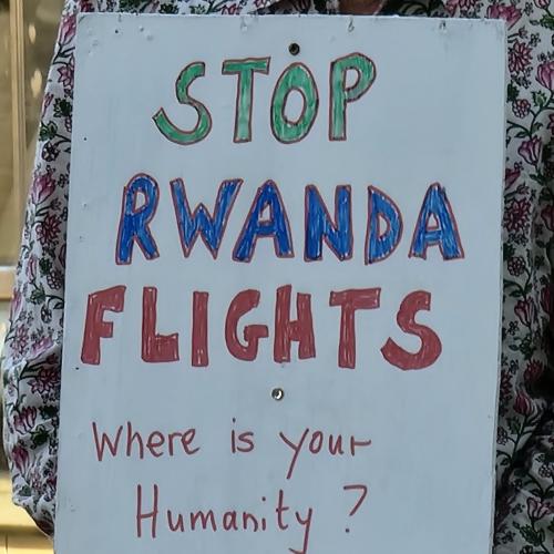 placard saying 'Stop Rwanda Flights'