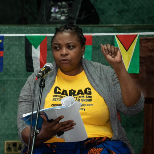 Loraine Masiya Mponela reciting one of her poems