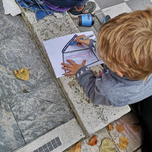 Humanity Knows No Borders Or Nationality: a boy draw a picture