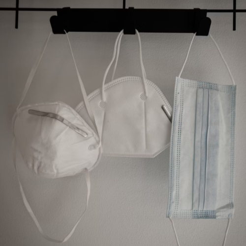 face masks hung on the clothes rack