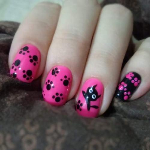 Hand with pink nail polish