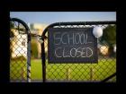School gate with sign "school closed"