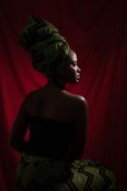 Fegor Lois Onoworemu posed in a red backdrop