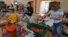 Volunteers work at the food bank sorting food