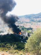 black smoke from Fire at Samos Camp