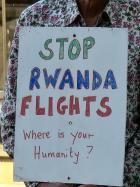 placard saying 'Stop Rwanda Flights'