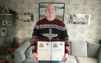 Steven Wilson, holding his Open University certificates