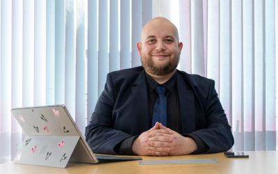 Callum Mullen from Tank Studios posing with his laptop