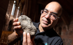 Prof. Mahesh Anand holding a meteorite 