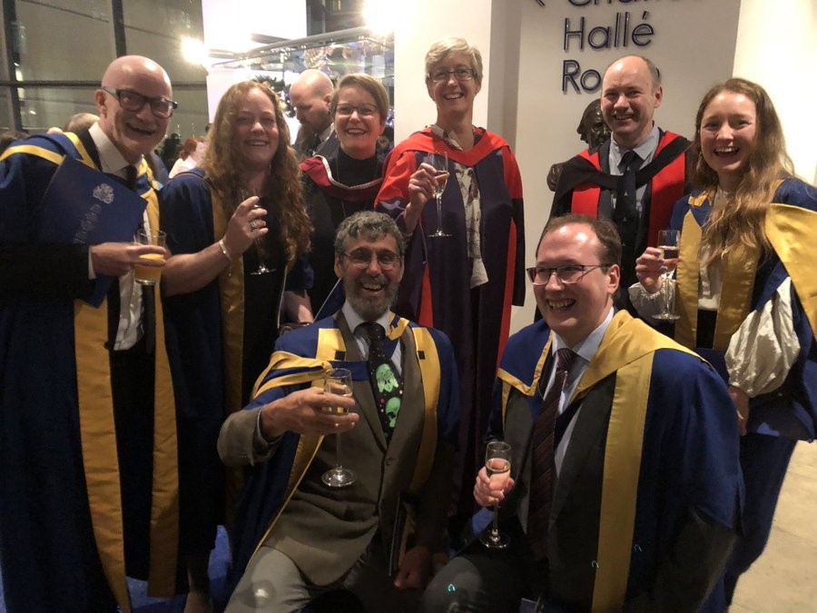 Open University staff celebrating the graduation of three PhD students, Eleni Wood, Stacy Phillips and Chris Malliband. 