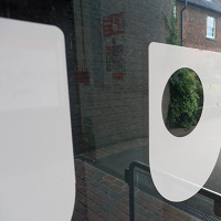 Open University logo on a glass building