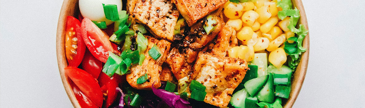 Colourful bowl of healthy food including vegetables and protein